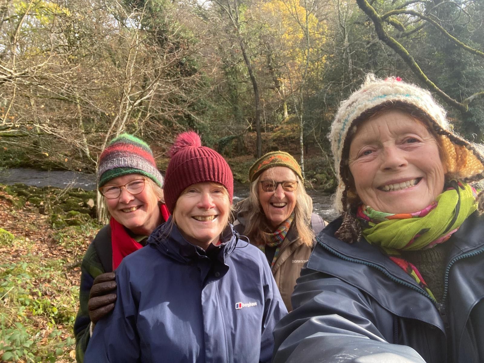 Group of happy Wellmoor wellbeing walkers enjoying a walk through a wooded area